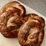 Four soft baked pretzels with rock salt